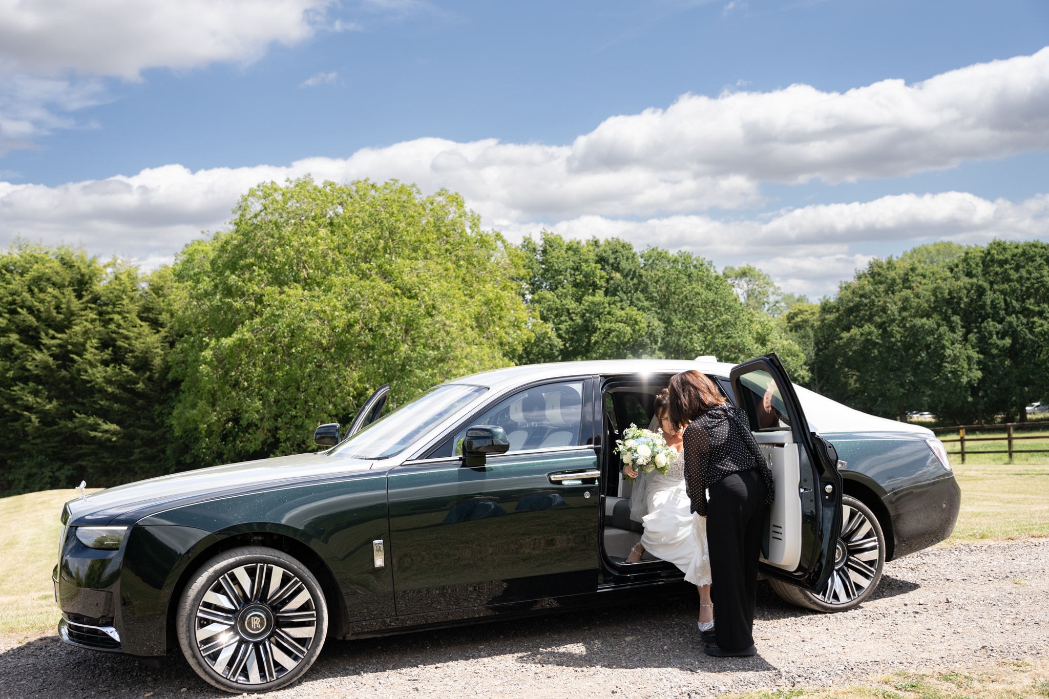Bride arriving in Rolls Royce at Notley Tythe Barn wedding
