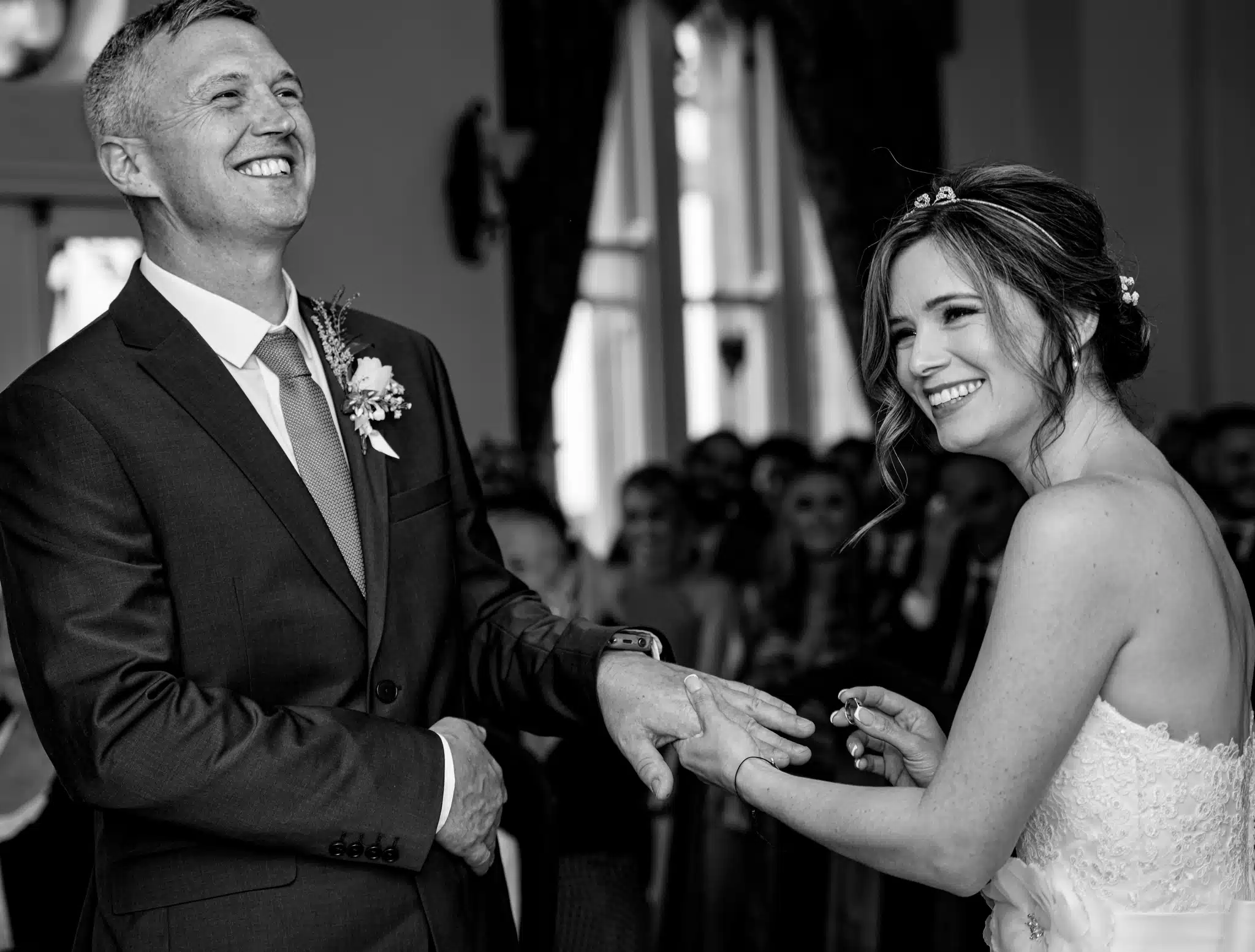 bride and groom exchanging rings at the gatehouse st albans