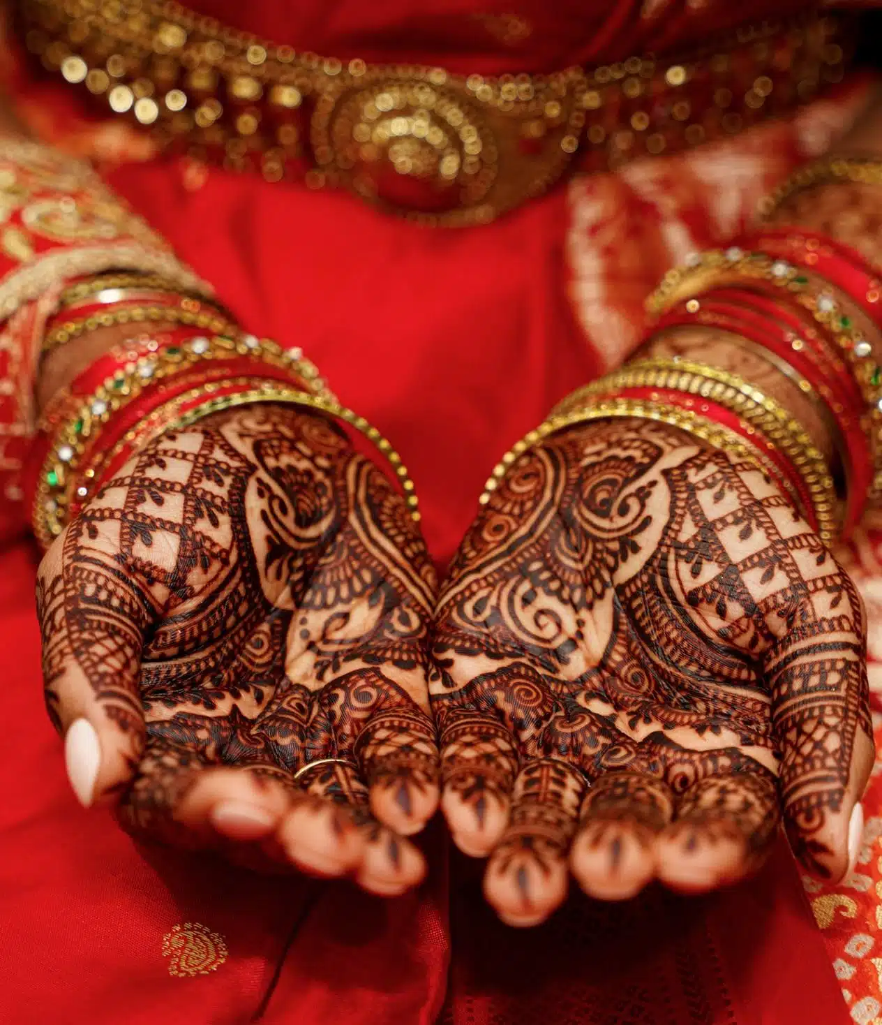 Asian wedding hands with red wedding dress