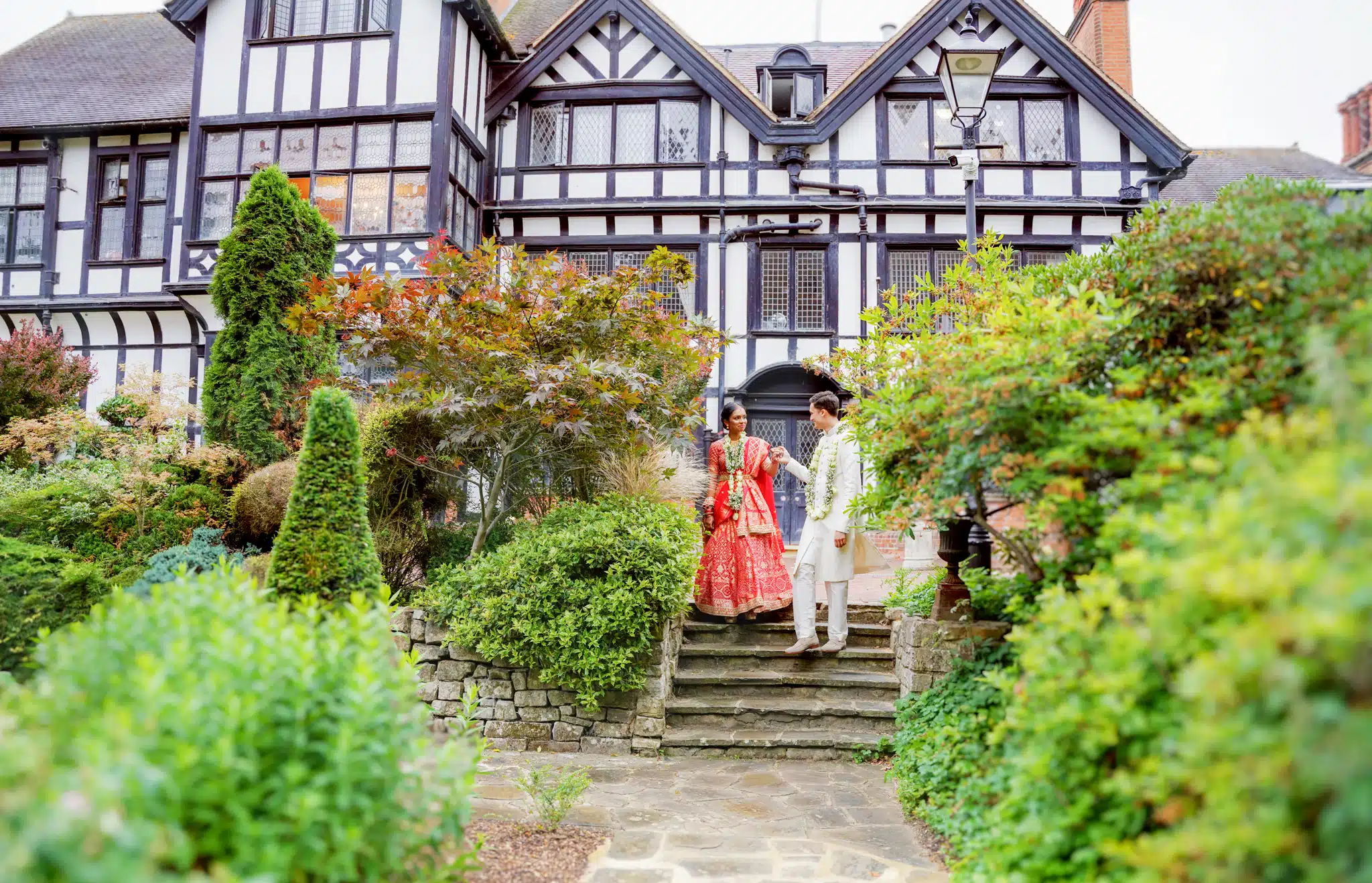 Bride and groom walking through Blenheim Palace gardens – wedding photographer Oxfordshire