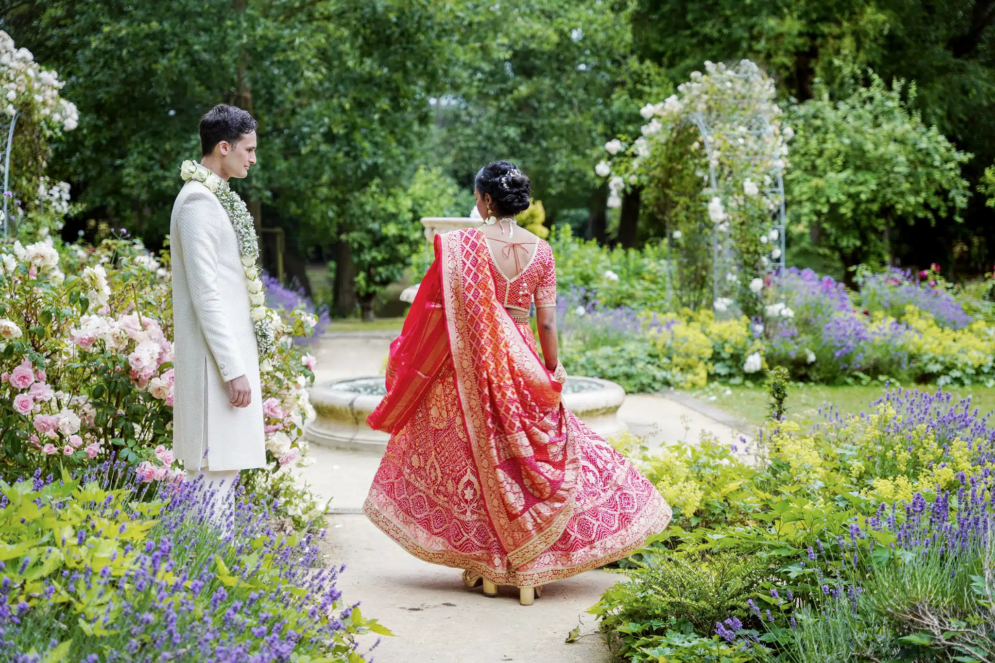 Bride and groom walking through Blenheim Palace gardens – wedding photographer Oxfordshire
