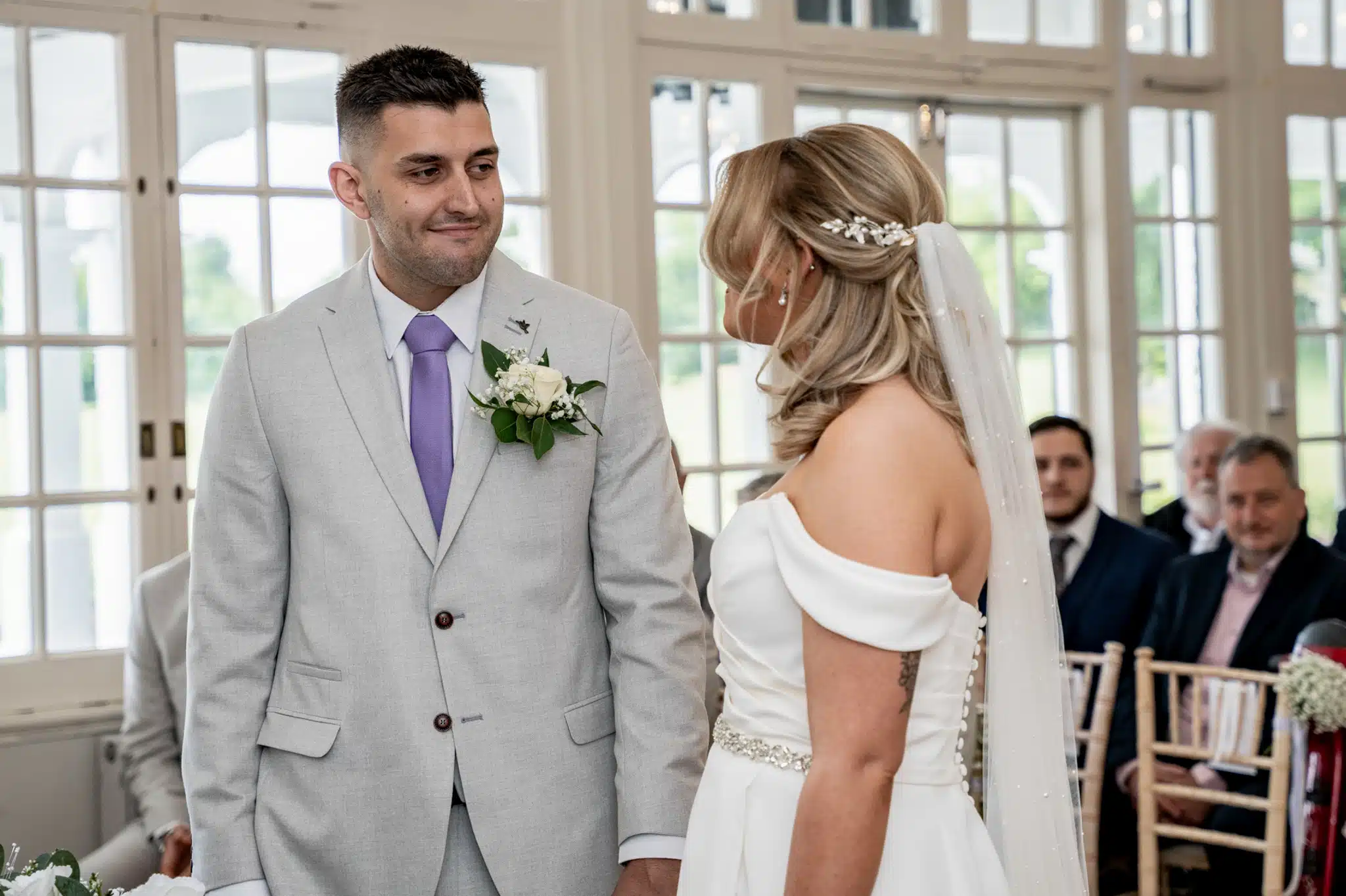 Candid laughter during wedding speeches at a Buckinghamshire manor house