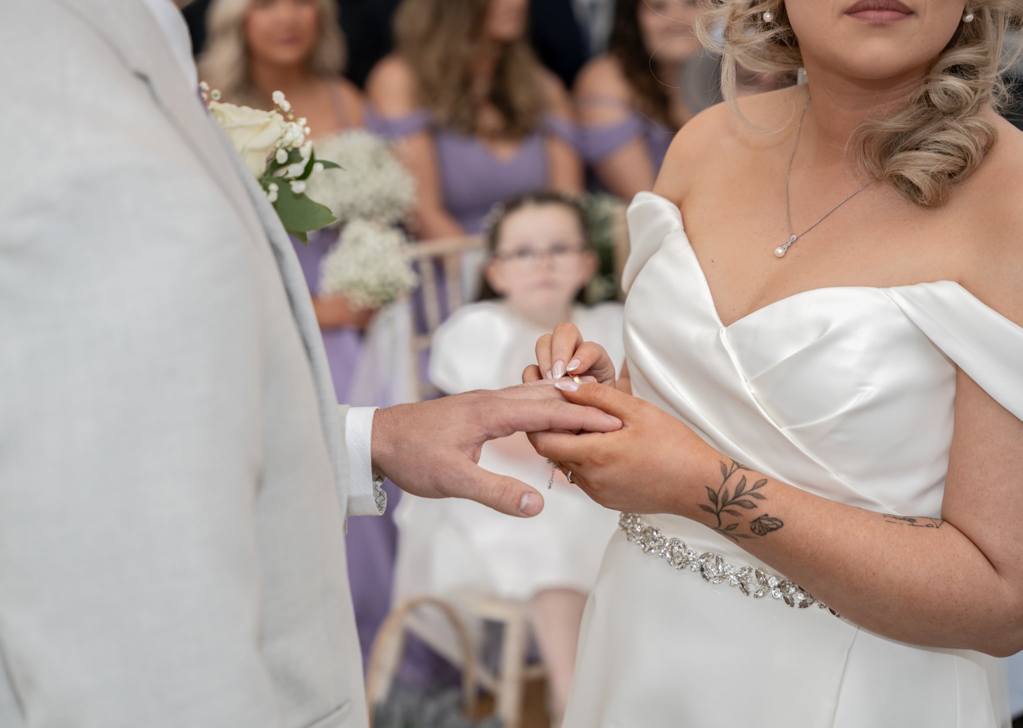 bride and groom exchanging rings