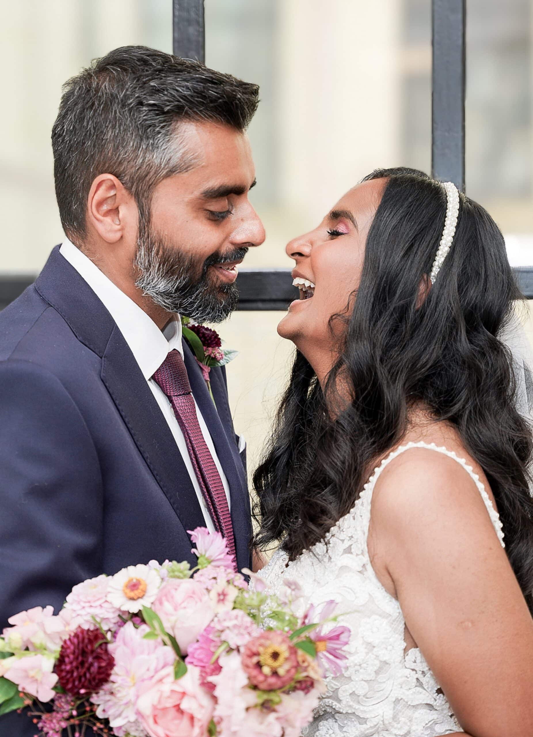 bride and groom laughtng