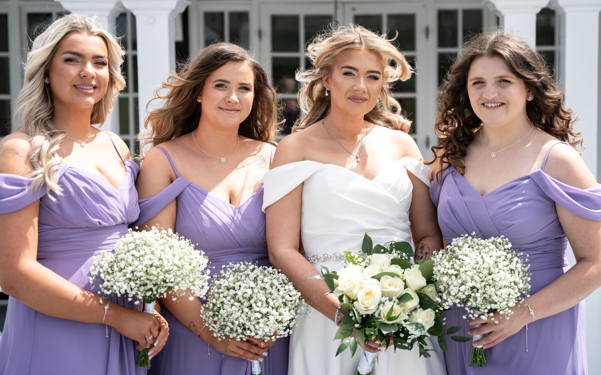 Bridesmaids and bride wearing lavender at shenley cricket club