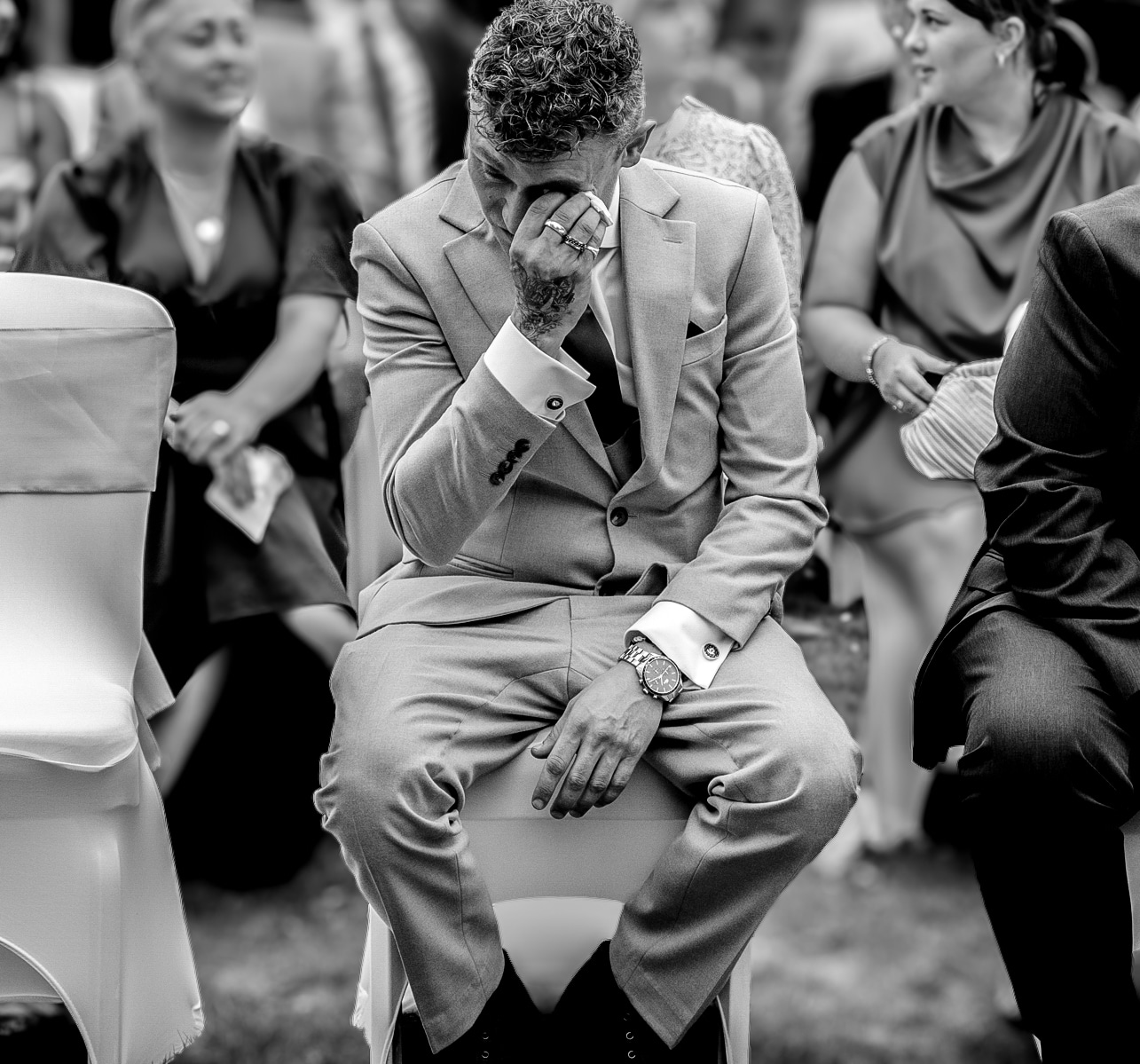 Groomsman crying at sisters wedding