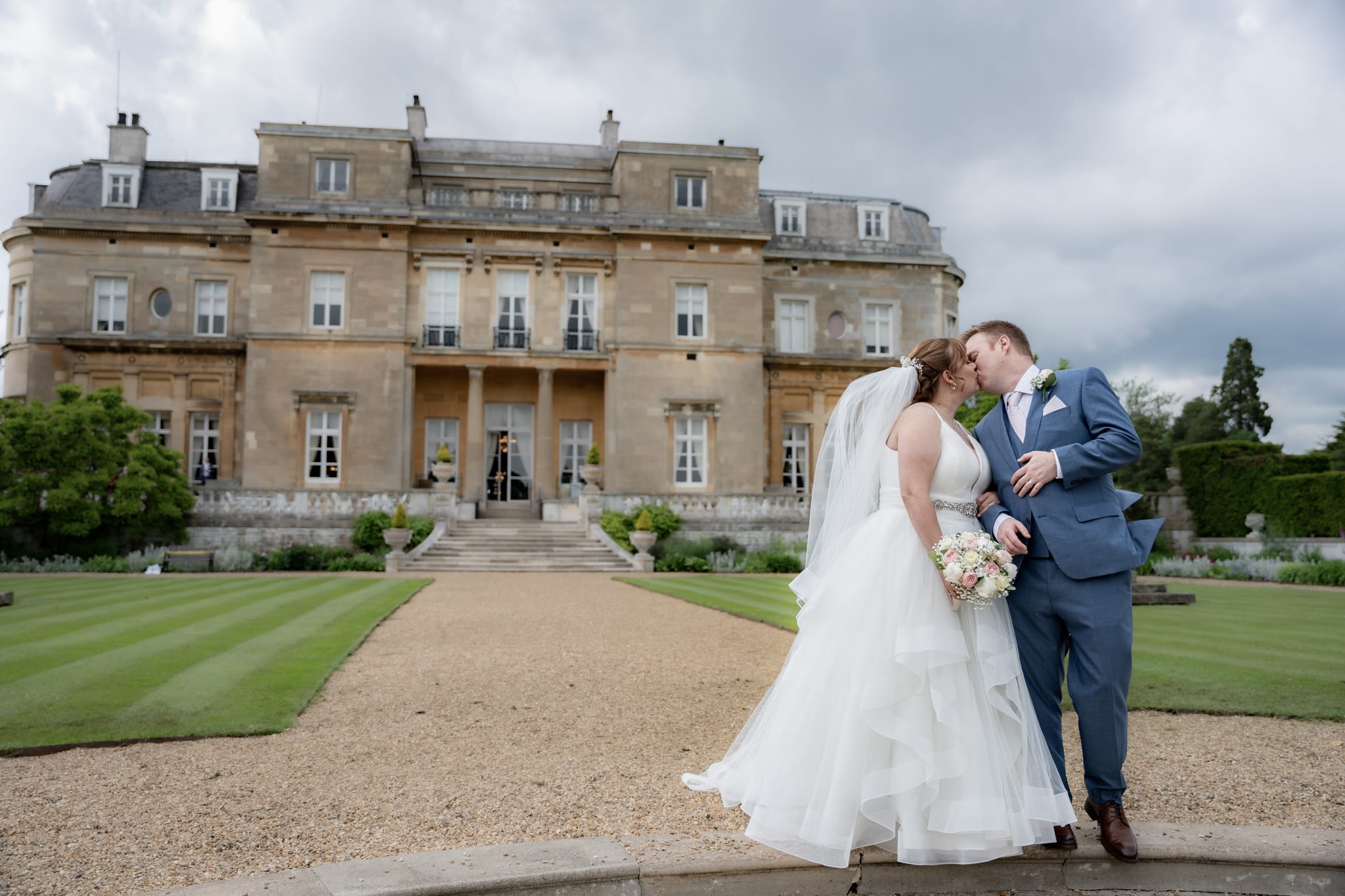 bride and groom kissing at luton hoo