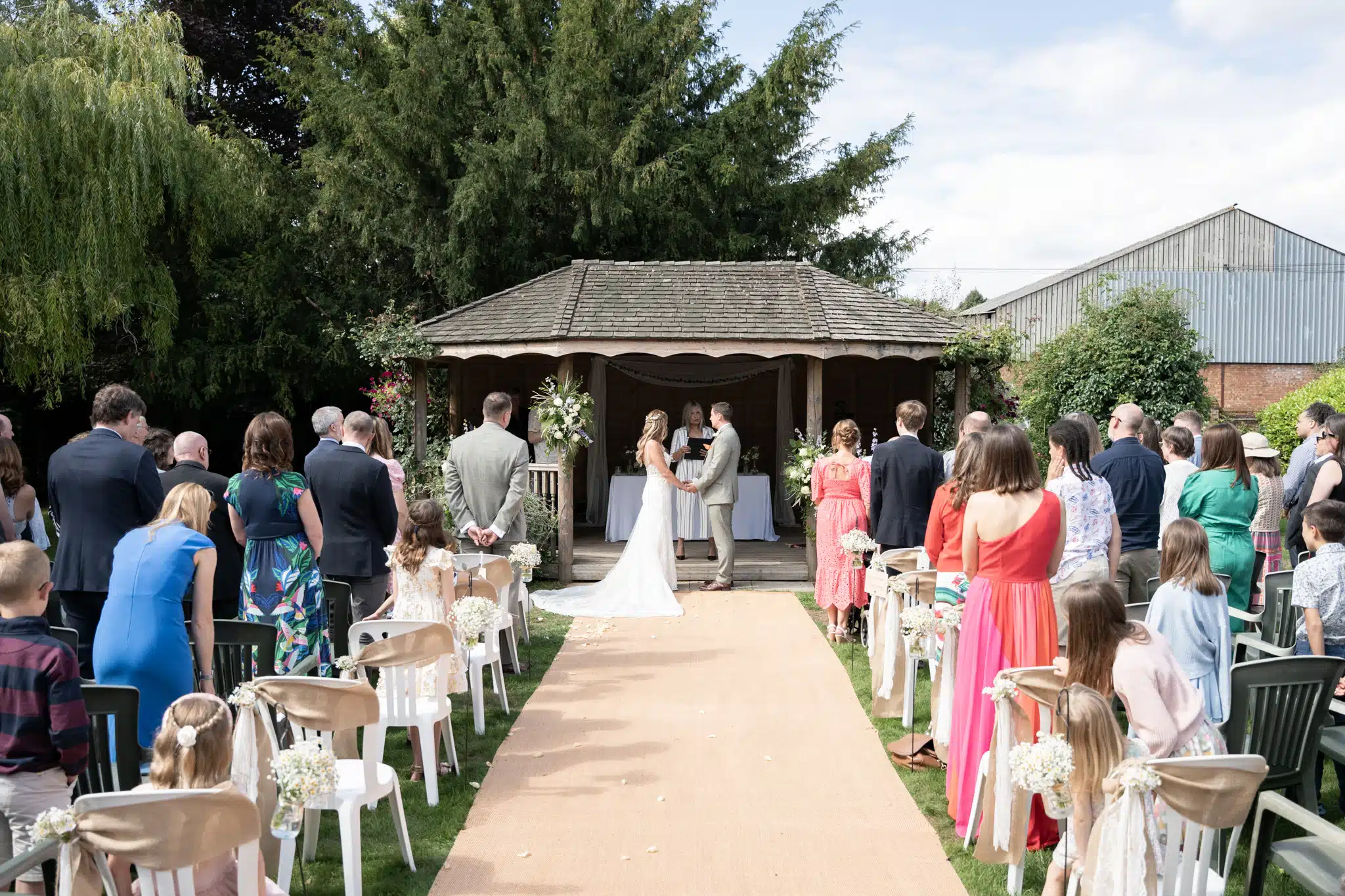 Bride and groom walking through Blenheim Palace gardens – wedding photographer Oxfordshire