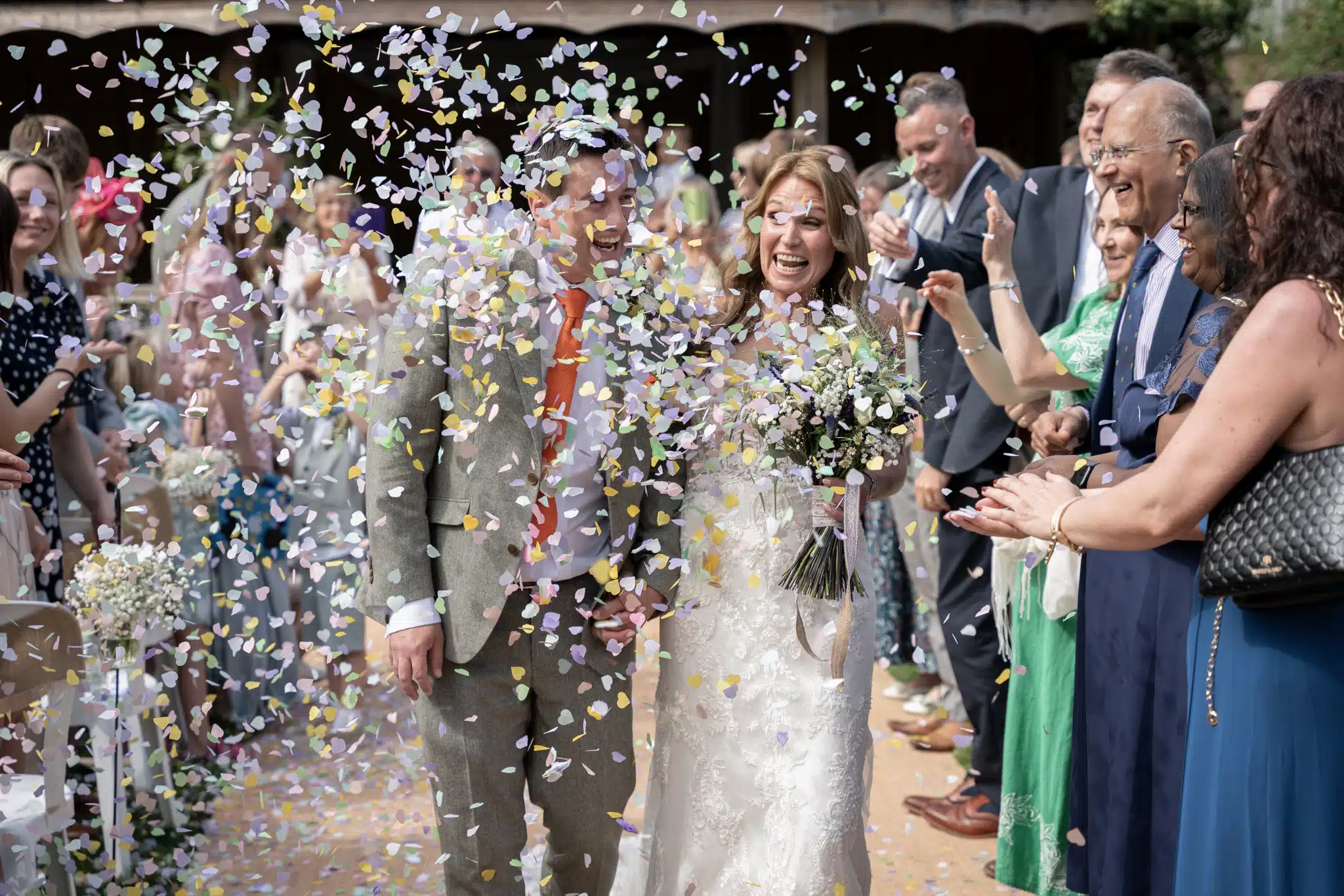 Candid laughter during ceremony in Oxfordshire countryside barn