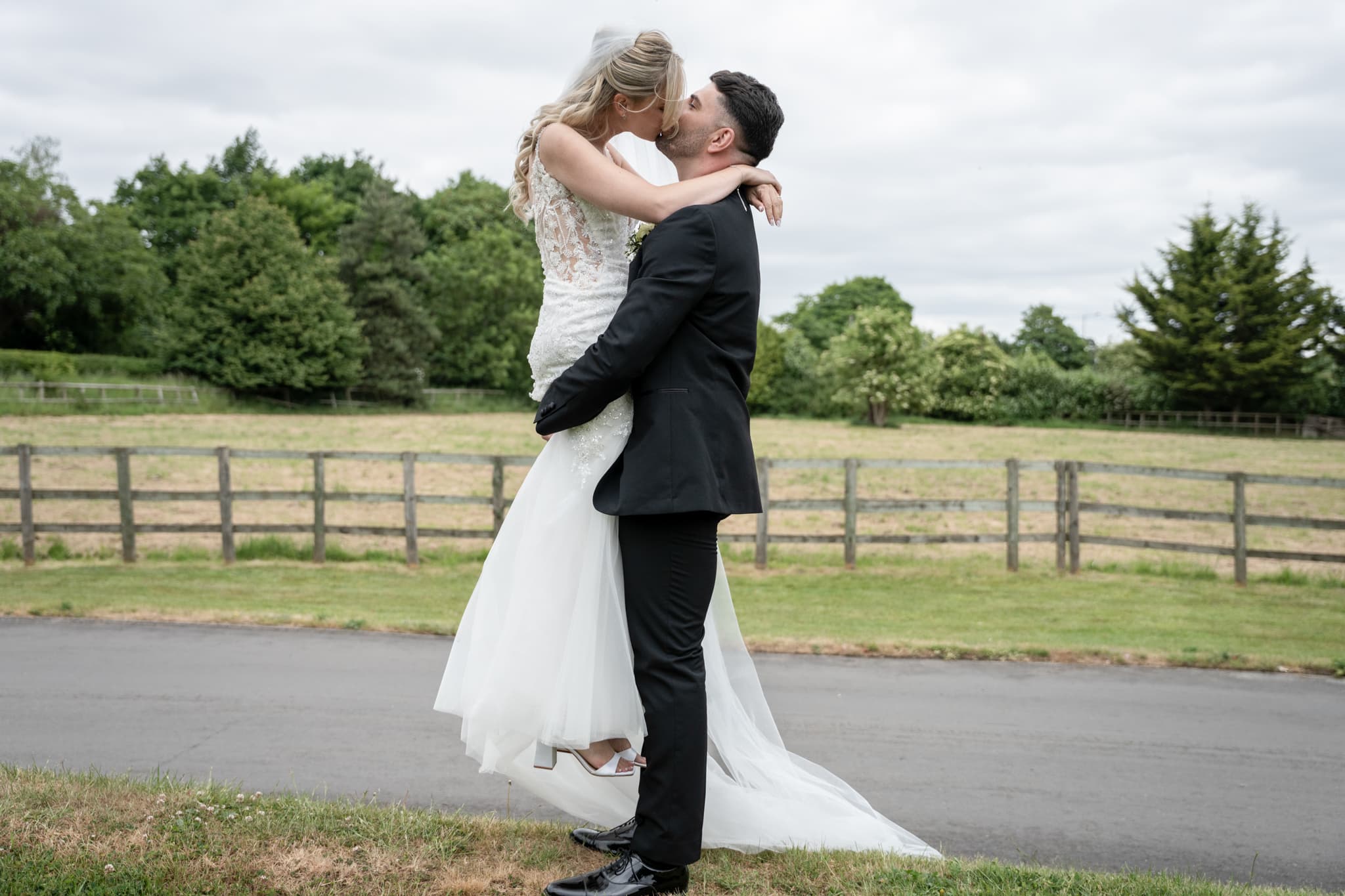 bride and groom kissing at tudor barn