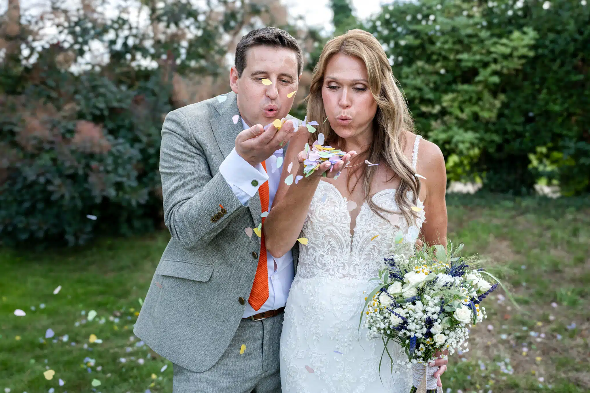 Bride and groom walking through Milton Keynes park – natural wedding photographer Milton Keynes