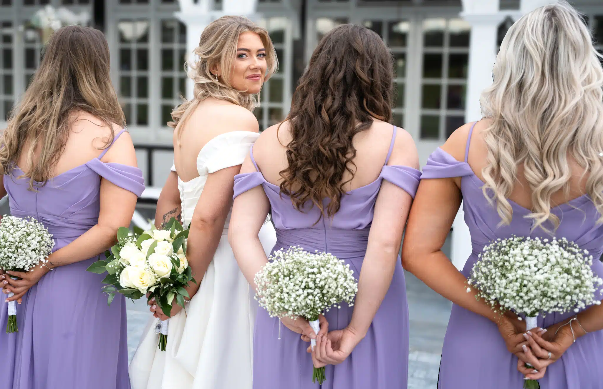 bride and bridesmaid’s holding flowers