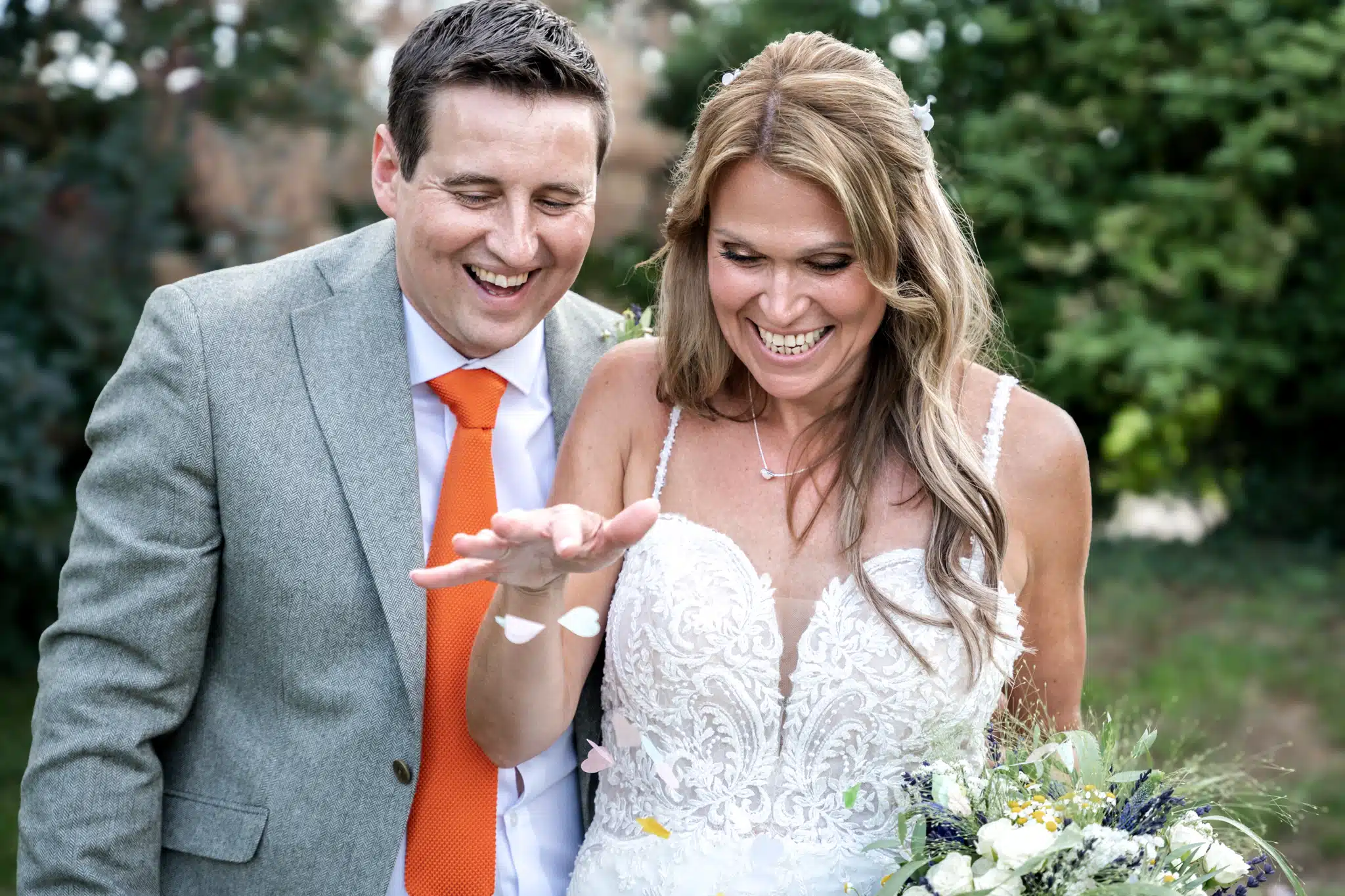 Bride and groom walking through Milton Keynes park – natural wedding photographer Milton Keynes
