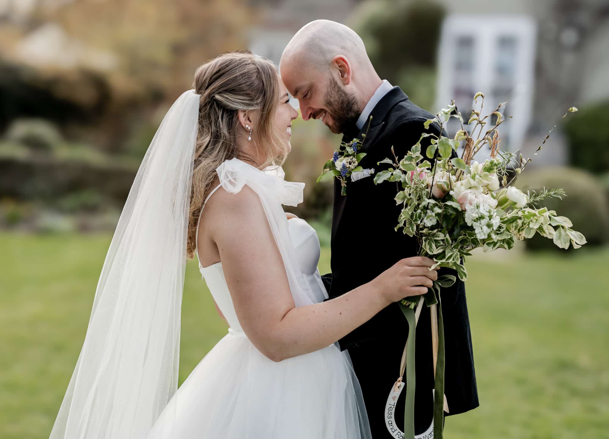 bride and groom embracing 