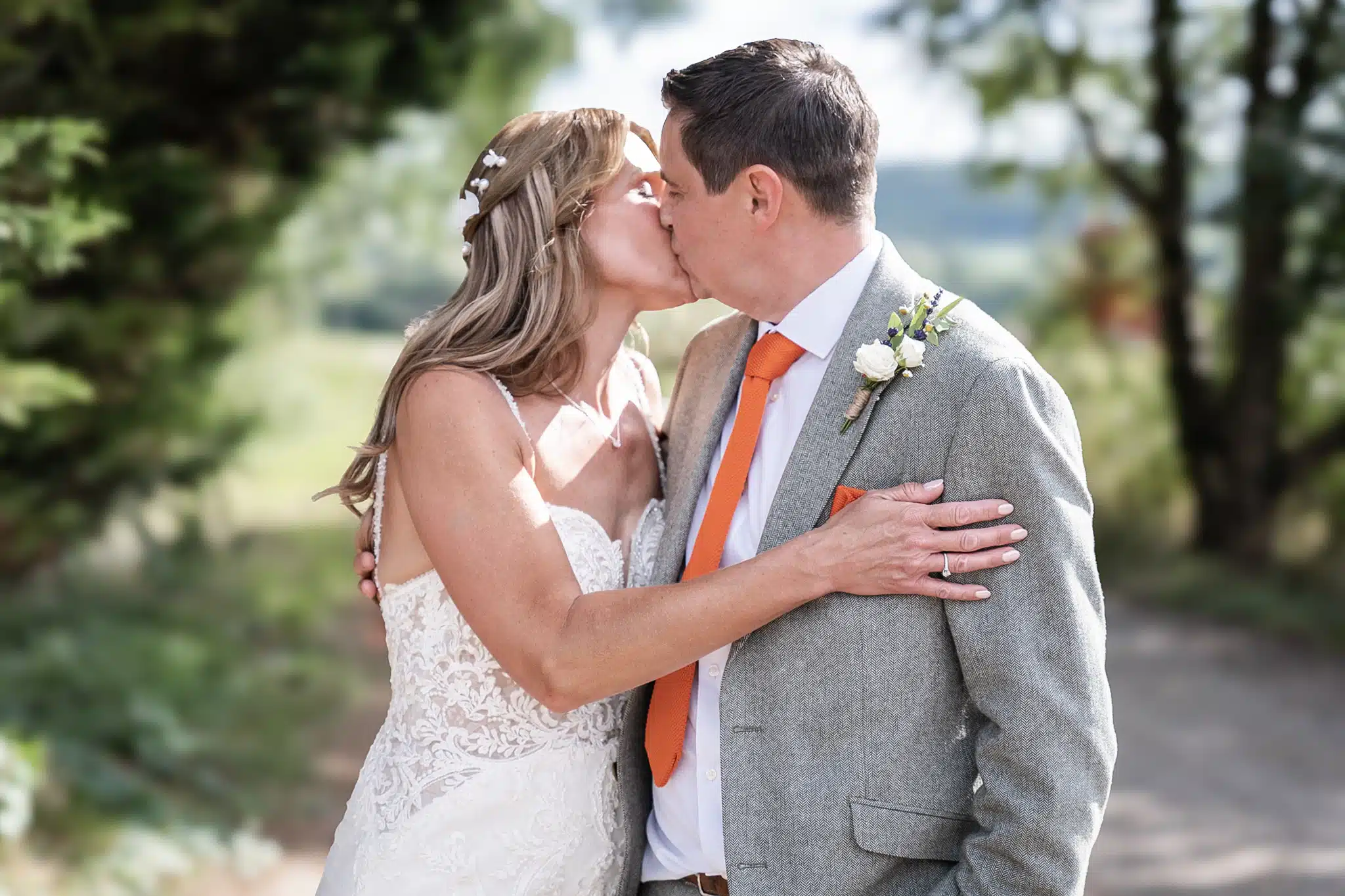 Bride and groom walking through Milton Keynes park – natural wedding photographer Milton Keynes