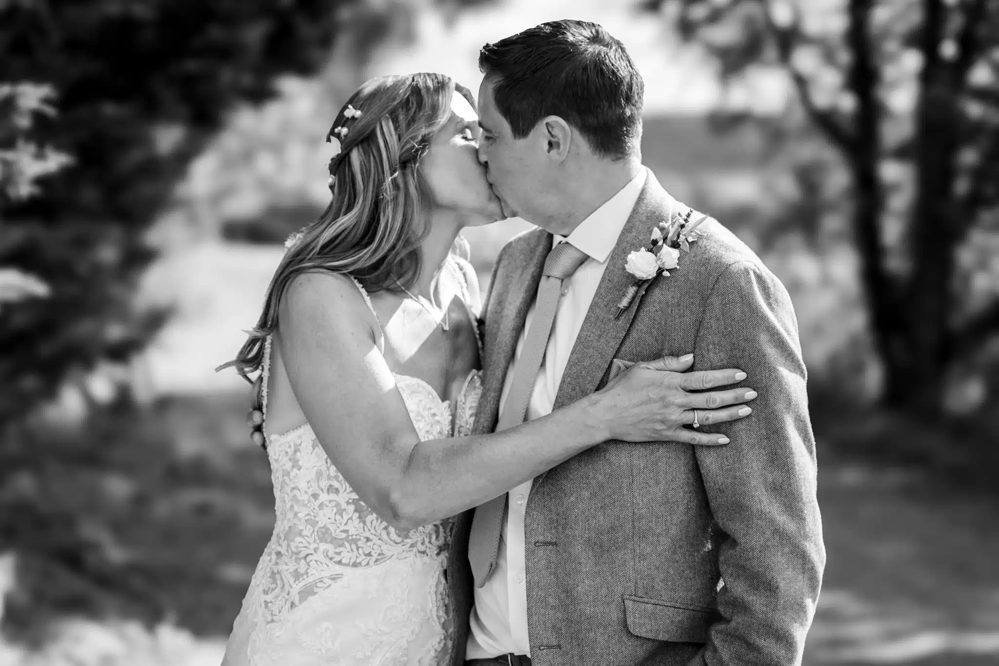 Bride and groom walking through Milton Keynes park – natural wedding photographer Milton Keynes