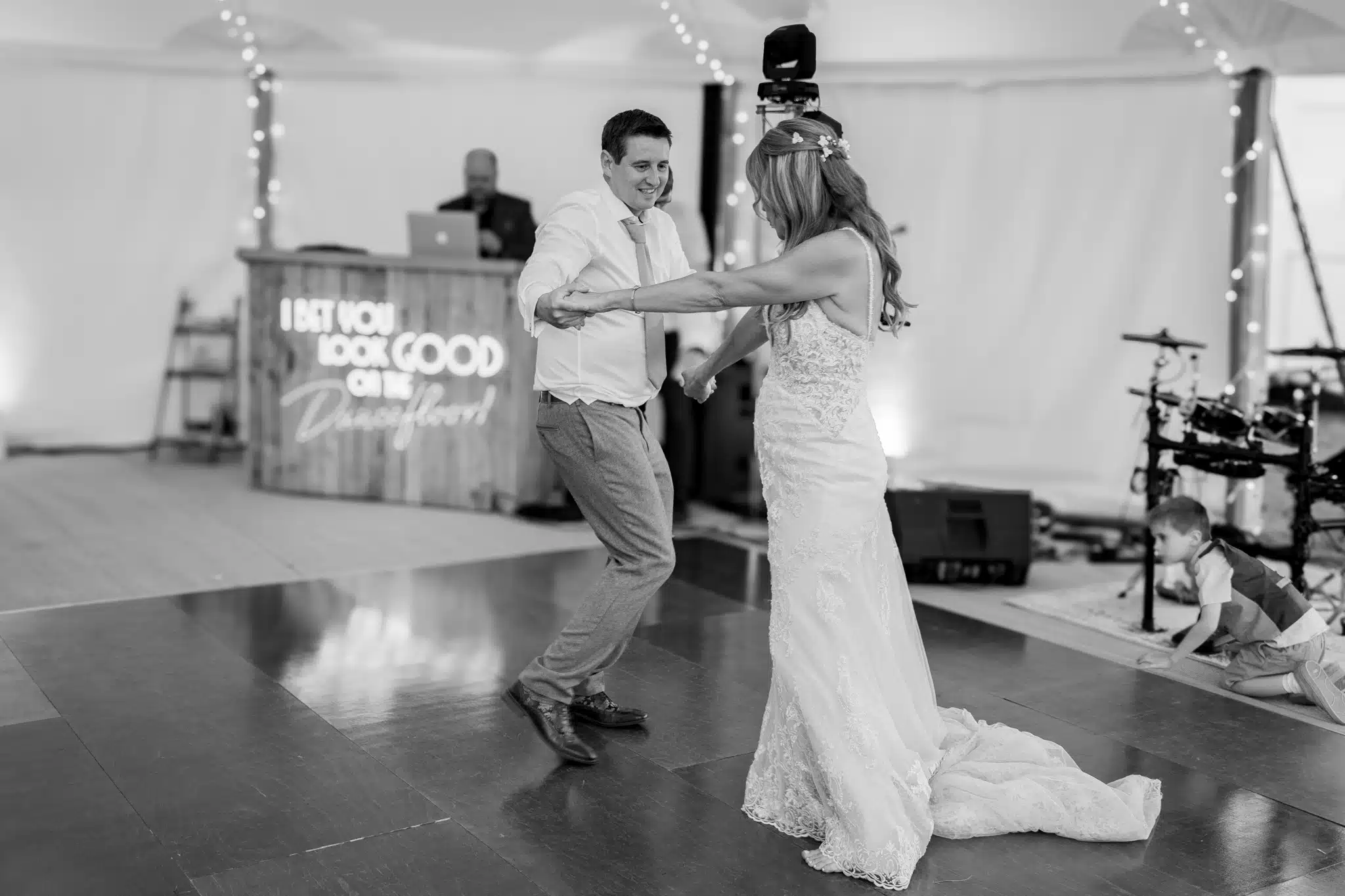 Bride and groom walking through Milton Keynes park – natural wedding photographer Milton Keynes
