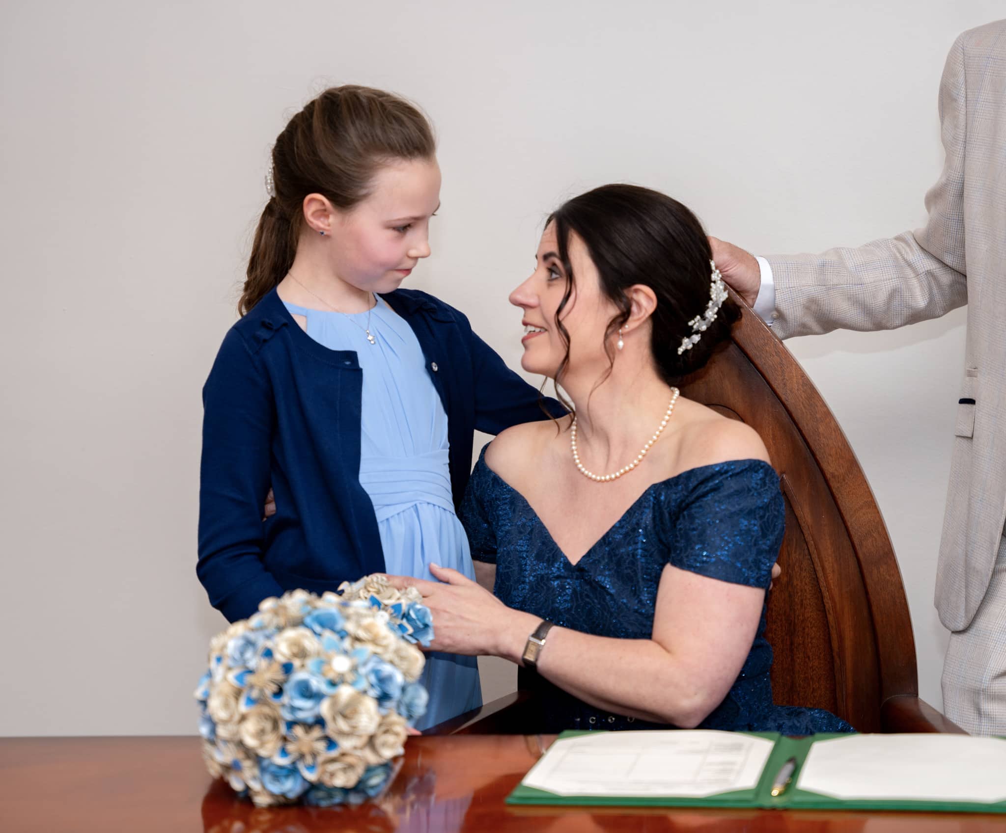 bride cuddling daughter st albans registry office
