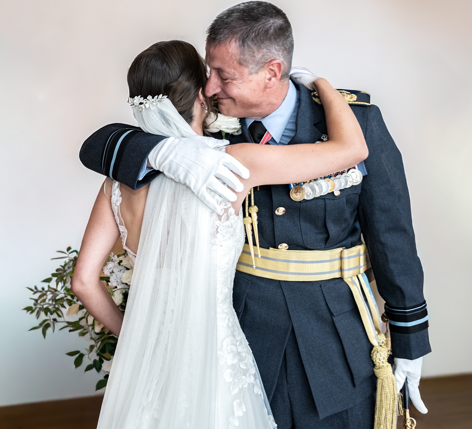 father embracing his daughter on her wedding day