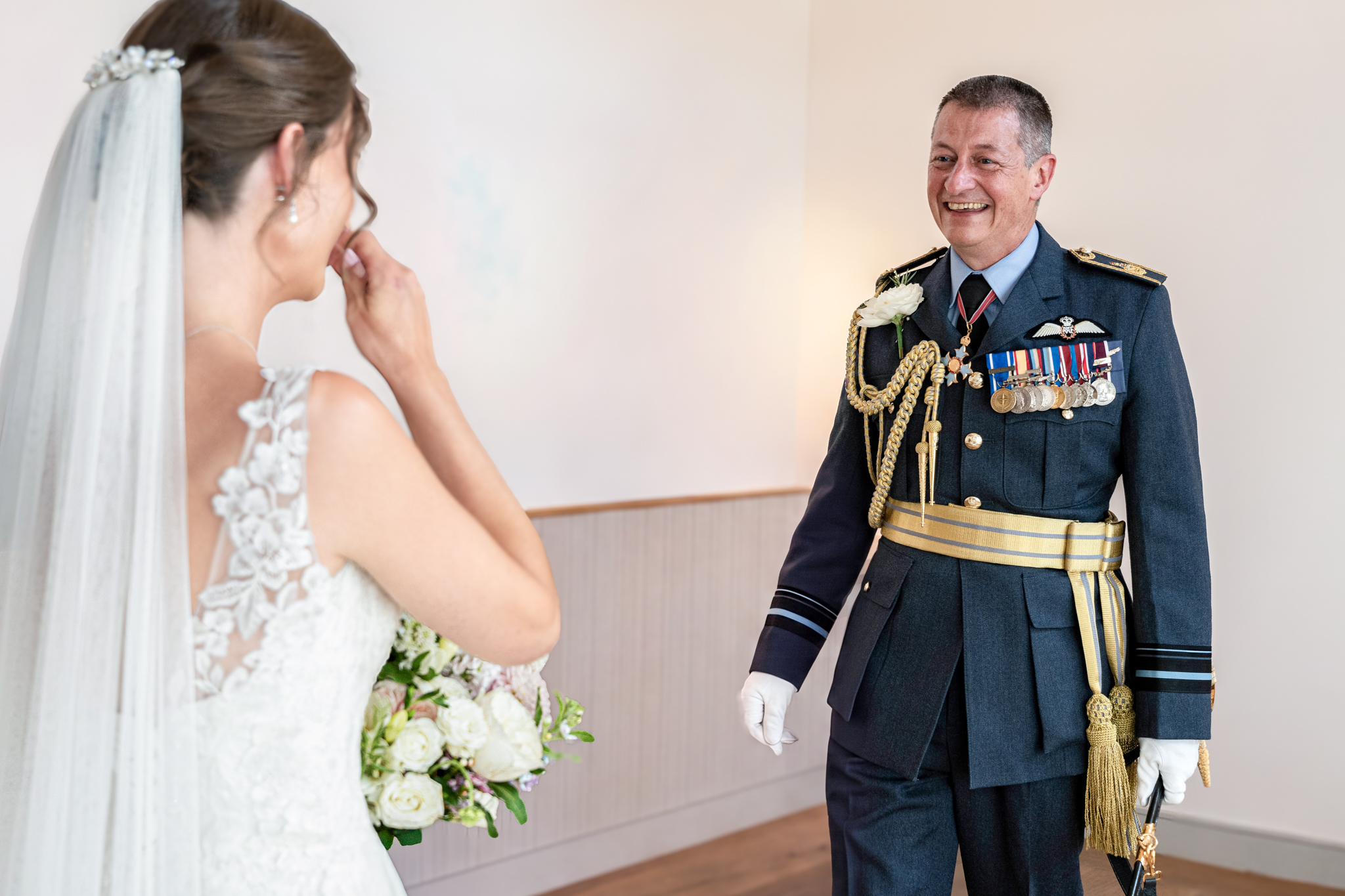 Father seeing his daughter, the bride for the first time after bridal prep