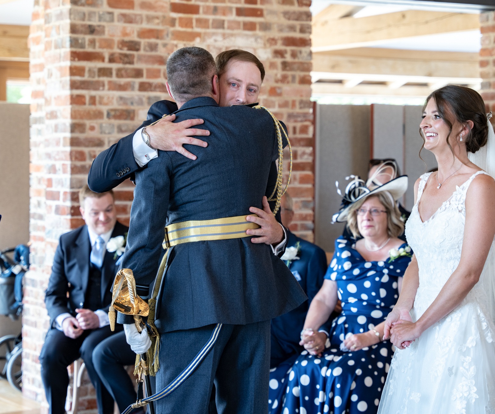 Groom and father of the bride embracing at Rackleys Barn, Chiltern Hills