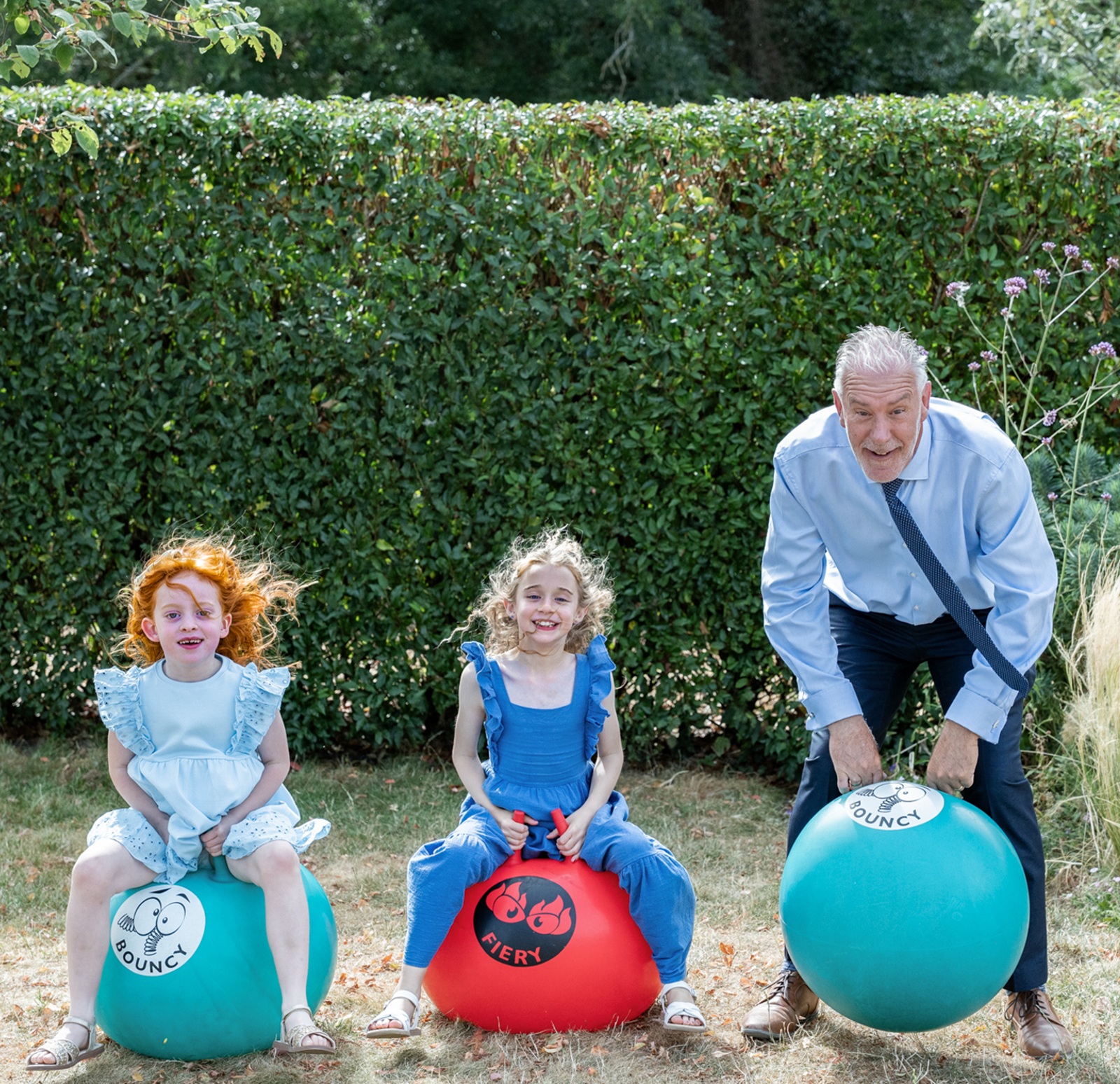 Kids and dad on spacehoppers at Rackleys Barn
